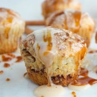 side view of Cinnamon Rolls Muffins with caramel cream cheese icing
