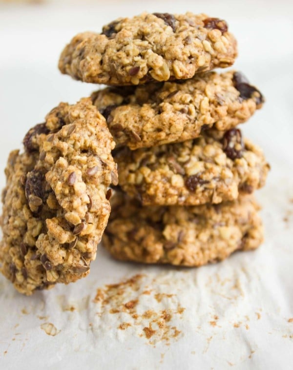 Healthy Oatmeal Raisin Cookies stacked up over each other and one on the side