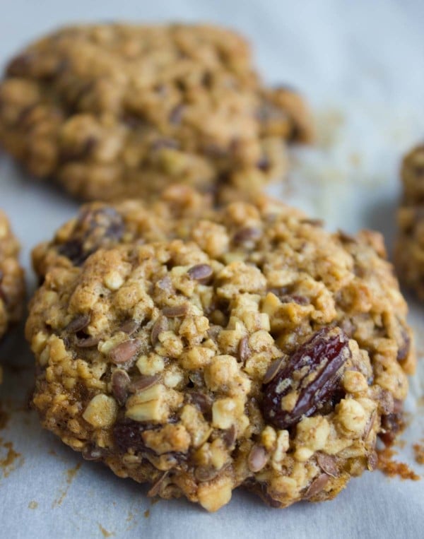 Healthy Oatmeal Cookies right out of the oven showing close up of the studded oats, raisins and flax seeds,