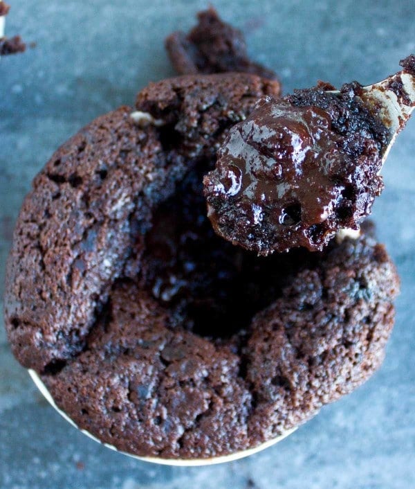 a spoon being dipped into a Mini Chocolate Pudding Cake 