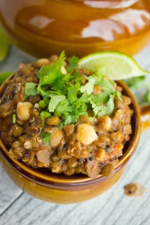 Moroccan Harira Soup with chickpeas, lentils and beans in a small brown soup bowl