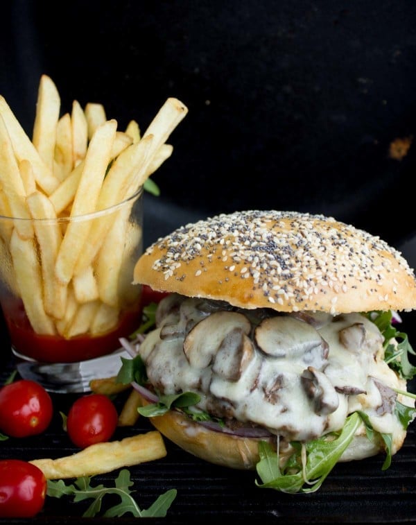 Mushroom Swiss Cheese Burger using homemade burger buns showing the mushrooms and melted cheese