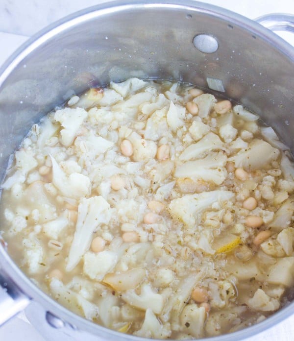 ingredients for cauliflower soup bubbling away in a pot, ready to be pureed