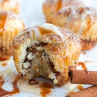 Cinnamon Rolls Muffin with one bite taken out the front