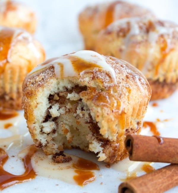 Cinnamon Rolls Muffin with one bite taken out the front