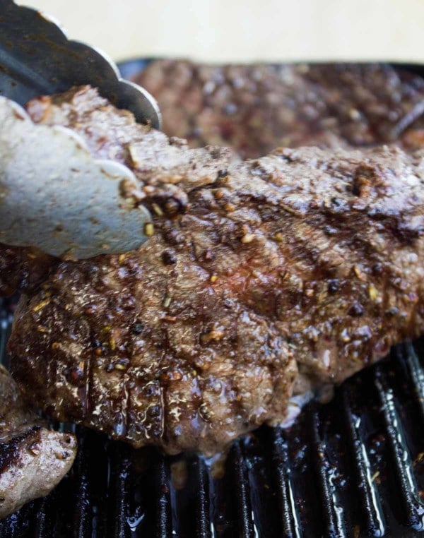 a tenderloin Steak being grilled on a bbq 