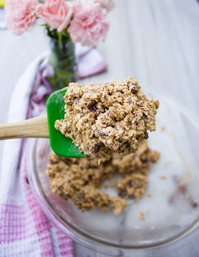 A spatula holding off the batter for the healthy oatmeal raisin cookie batter