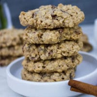 close up stack of healthy oatmeal cookies on a white plate