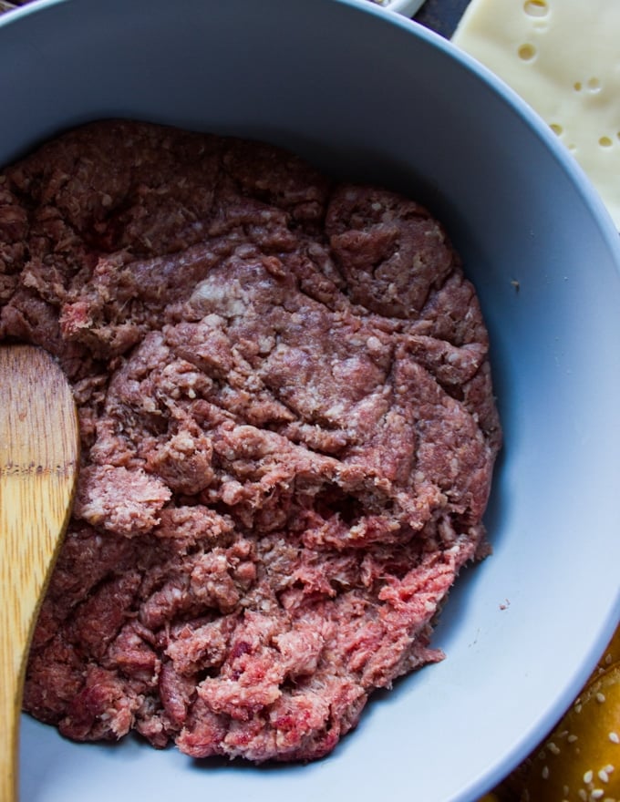 A bowl with lean ground beef close up showing the meat needed for the burgers