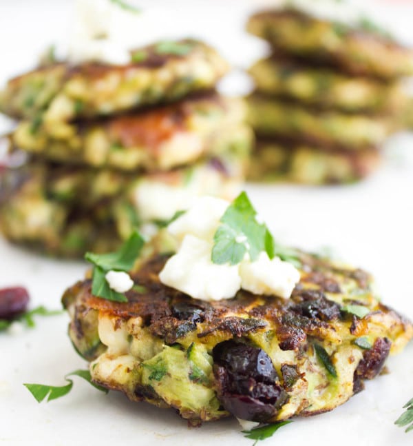 side view of Gluten-free Zucchini Fritter with cranberries and some crumbled feta on top