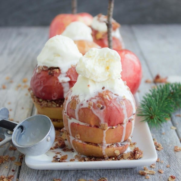 Baked Apples with Granola Crunch served with melting scoops of vanilla ice cream on top