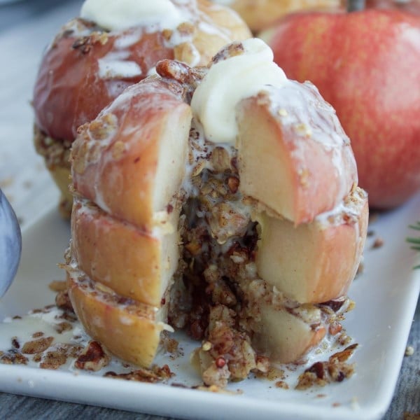 Baked Apple with Granola Crunch with a wedge cut out to reveal the granola filling