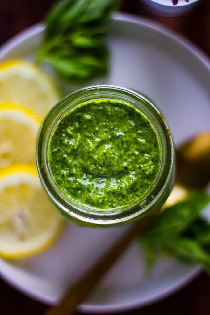 Close up of basil pesto in a jar from the top