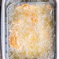 Chicken fingers submerged in hot oil and frying