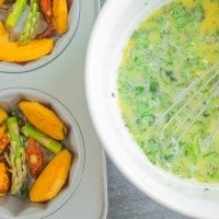 pan-fried vegetables in a muffin pan waiting to be topped with frittata egg batter.