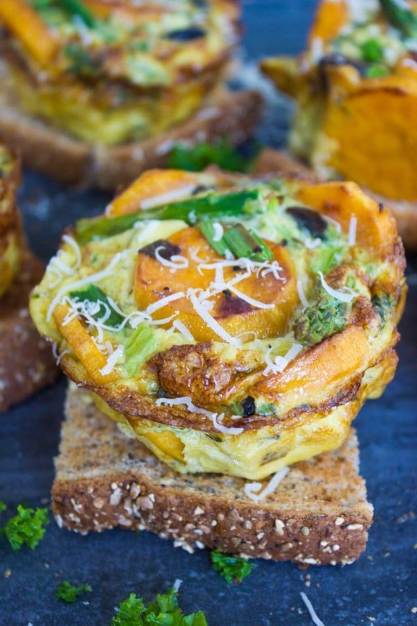 Close-up of a Frittata served on a slice of toasted whole wheat bread.