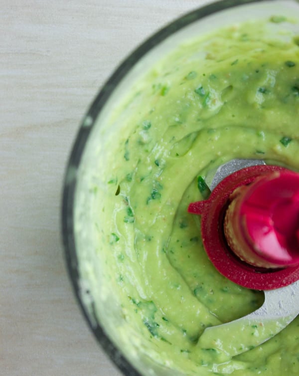 creamy avocado dressing in the bowl of a food processor