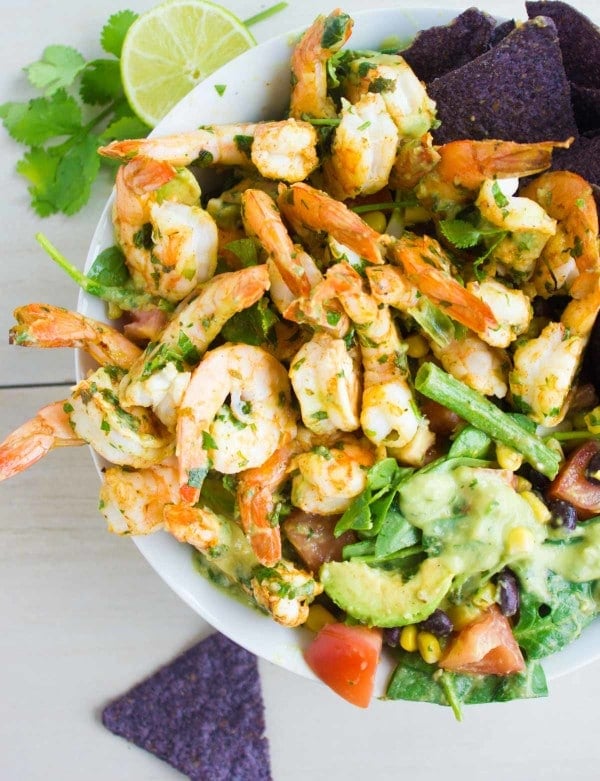 overhead shot of Mexican Shrimp Salad with black beans, corn and tossed with homemade avocado salad dressing