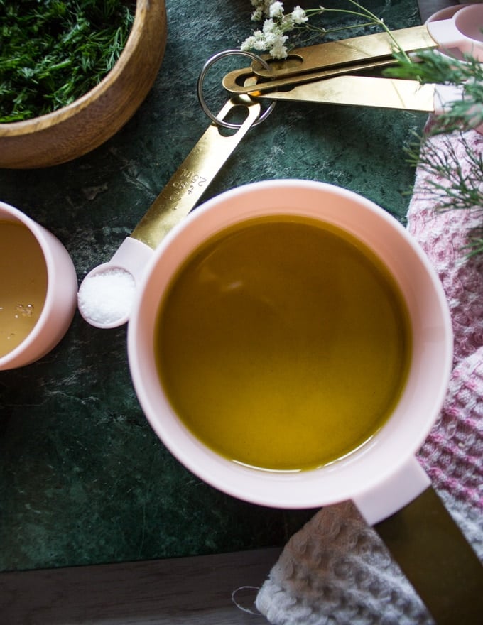 olive oil and salt in measuing spoos for the sauce 