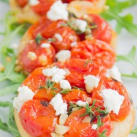 Mini Tomato Tarts Tatin on fresh arugula