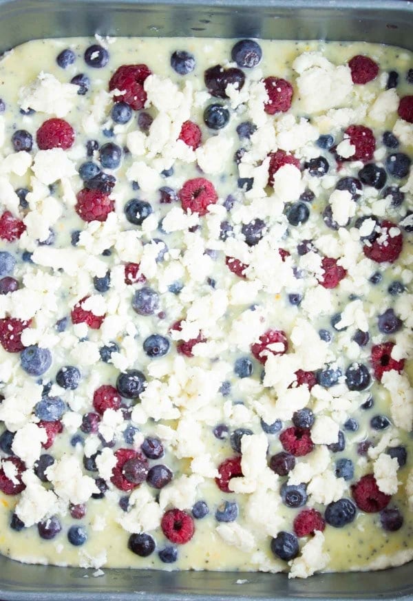 Berry Citrus Poppy Seed Bars sprinkled with extra cookie crumbles ready to go into the oven