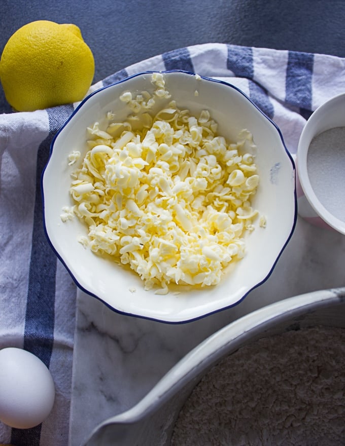 A bowl of frozen grated butter for flakey drop biscuits