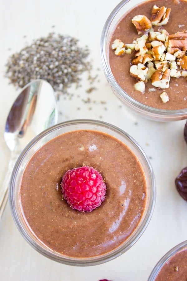 Instant Chia Puddings served in glasses and fresh raspberries