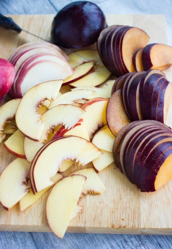sliced stone fruits on a chopping board
