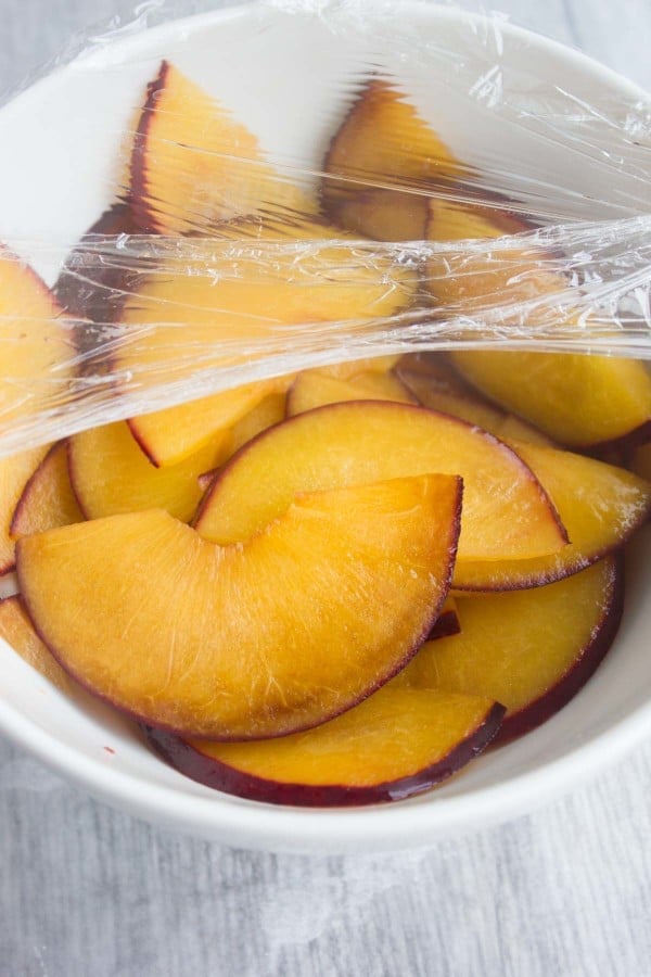 microwaved sliced plums in a bowl