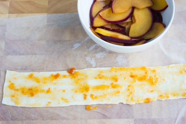 a strip of pie pastry brushed with jam