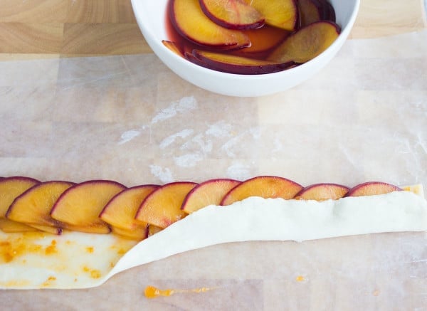 pastry folded over the fruit while exposing half of it