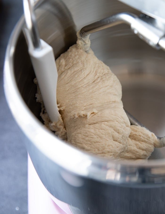 A close up of the dough kneading in the machine