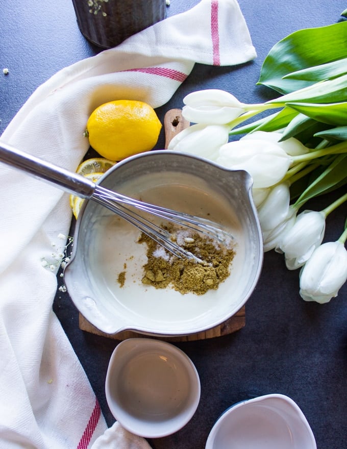 whisked water and tahini paste and lemon juice, then salt and cumin on the top