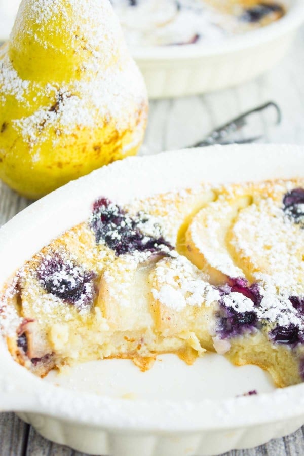 half eaten Blueberry Pear Clafoutis in an individual casserole