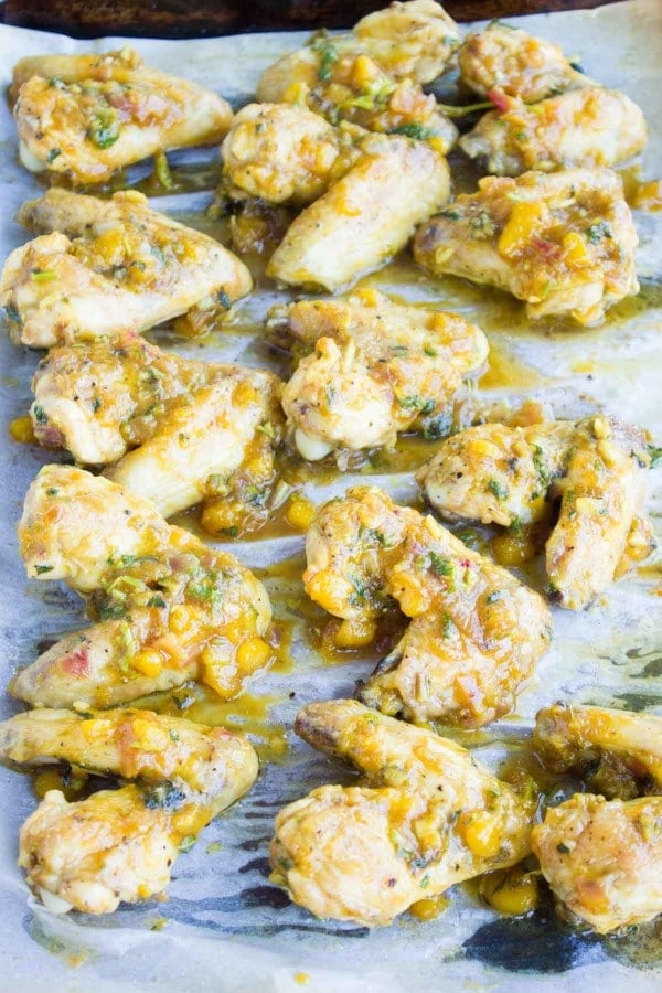 Spicy Chicken Wings tossed in mango chutney ready be baked in the oven