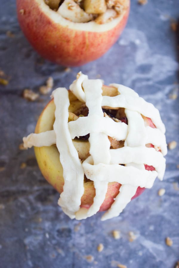 Apple Pie Stuffed Apples being topped with pie lattice