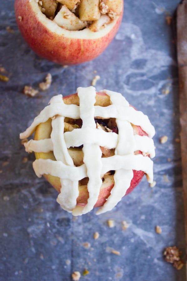 Apple Pie Stuffed Apples being topped with pie lattice