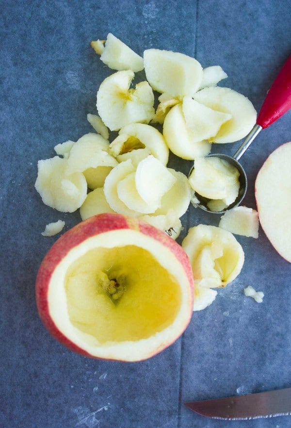 an apple hollowed out with a melon baller