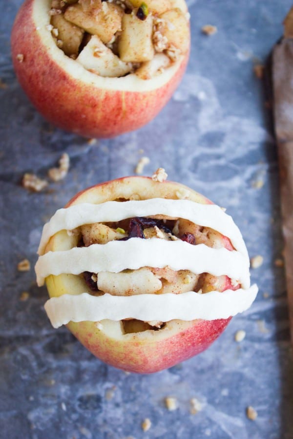 Apple Pie Stuffed Apples being topped with pie lattice