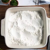 the seasoned flour in a bowl fro dredging the calamari