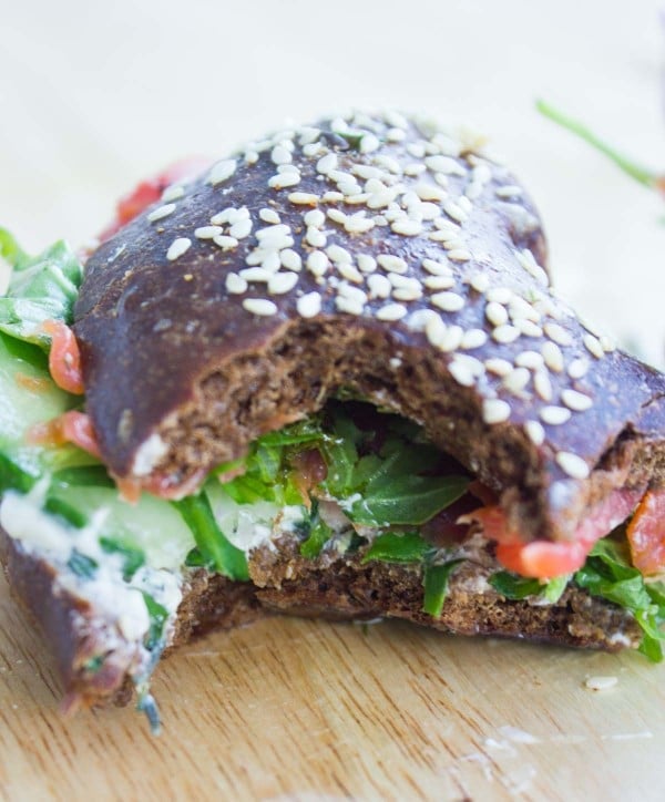 Close-up of a Smoked Salmon Breakfast Bagel with a big bite taken out the front