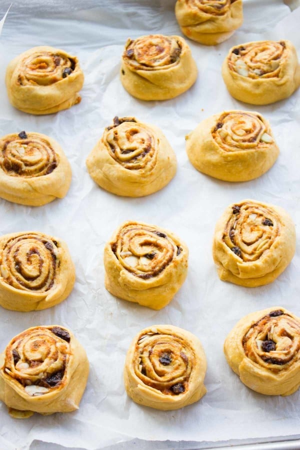 Pumpkin Cinnamon Rolls arranged on a baking tray ready to bake