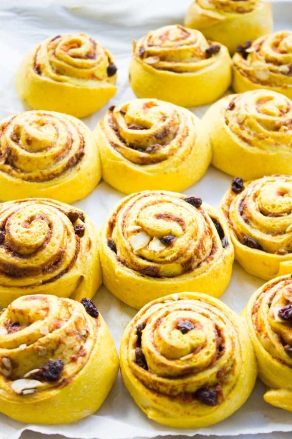 freshly baked unglazed Pumpkin Cinnamon Rolls on a baking tray