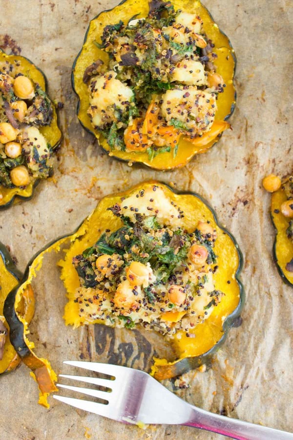 overhead of Quinoa Kale Stuffing served on baked acorn squash rings on a baking tray
