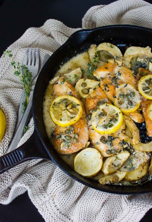 Lemon Caper Artichoke Chicken Piccata in a black skillet