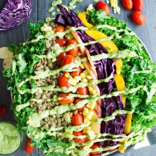 Mexican Style Lentil Detox Salad. The perfect way to cook lentils and to make the perfect detox salad with a Mexican twist drizzled with an AMAZIG guacamole dressing! Vegan and gluten free. www.twopurplefigs.com