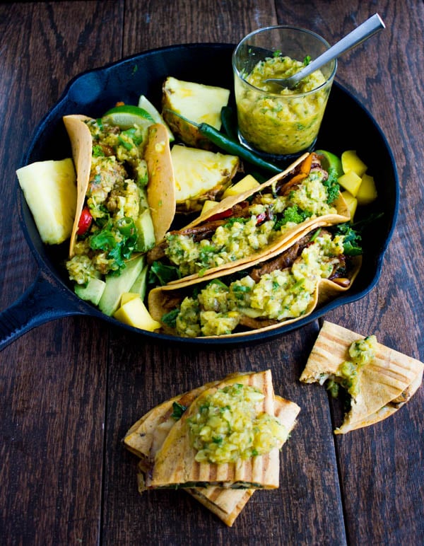 Chicken Fajita With Mango Pineapple Salsa served in tortillas and arranged in a black skillet