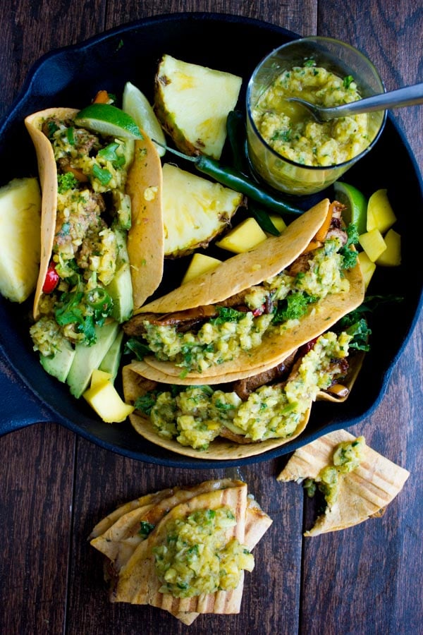 Chicken Fajita With Mango Pineapple Salsa served in tortillas and arranged in a black skillet