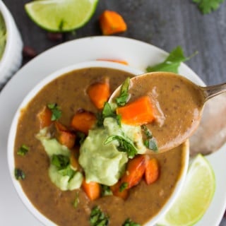Sweet Potato Black Bean Soup. Quick, easy, creamy and super satisfying soup to unwind with! Twisted with some sweet potatoes, avocado crema and more sweet potato cubes--this soup is Vegan and so GOOD for you! www.twopurplefigs.com