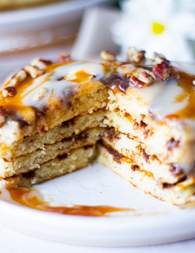 close up of cinnamon roll pancake cut up showing the inside texture